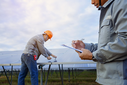 Engineers are checking the solar panel for maintenance. And clean the solar panel is always available.