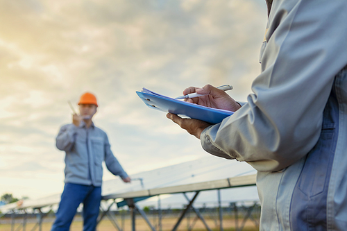 Engineers are checking the solar panel for maintenance. And clean the solar panel is always available.