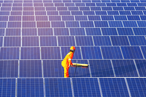 Engineers are checking the solar panel for maintenance. And clean the solar panel is always available.