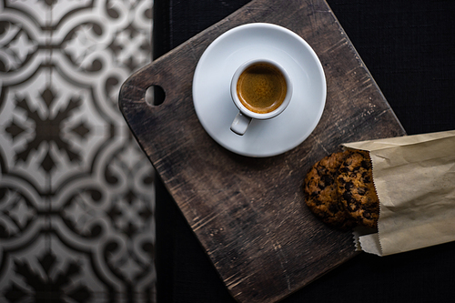Homemade cookies with chocolate and coffee on rustic background with copy space
