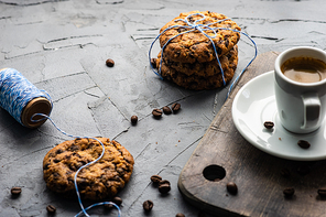 Homemade cookies with chocolate and coffee on rustic background with copy space