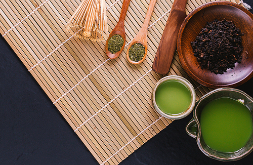 green tea matcha in a bowl on wooden surface