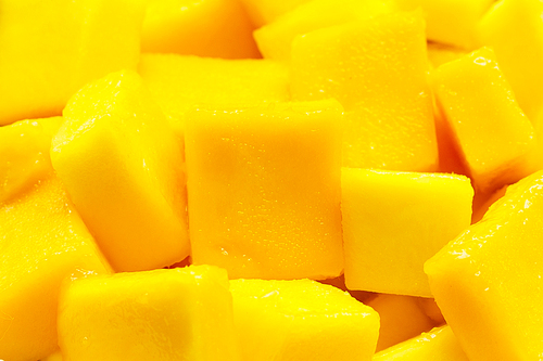 Tropical fruit, Mango cube slices background.