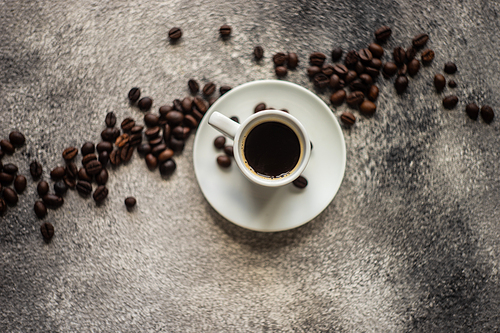 Cup of morning coffee with cinnamon stics and anise star as a drink concept with copy space