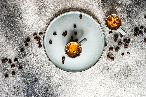 Morning coffee concept with coffee beans on grey concrete background with copy space