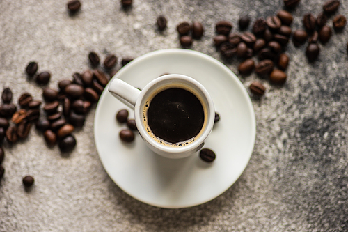 Cup of morning coffee with cinnamon stics and anise star as a drink concept with copy space