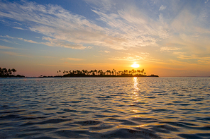 Sunset at the beautiful tropical paradise island on Maldives