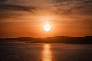 Giant sun over the coast of Spain
