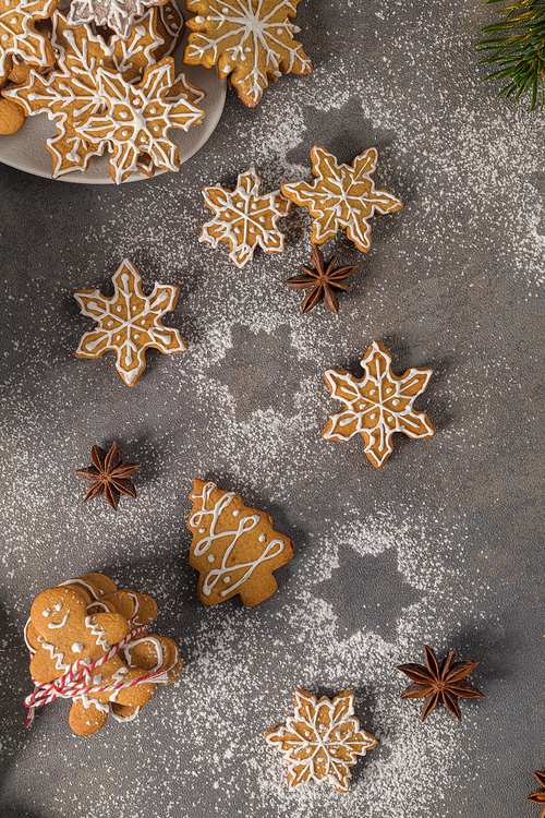 Christmas cookies on kitchen countertop with festive decorations.