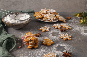 Christmas cookies on kitchen countertop with festive decorations.