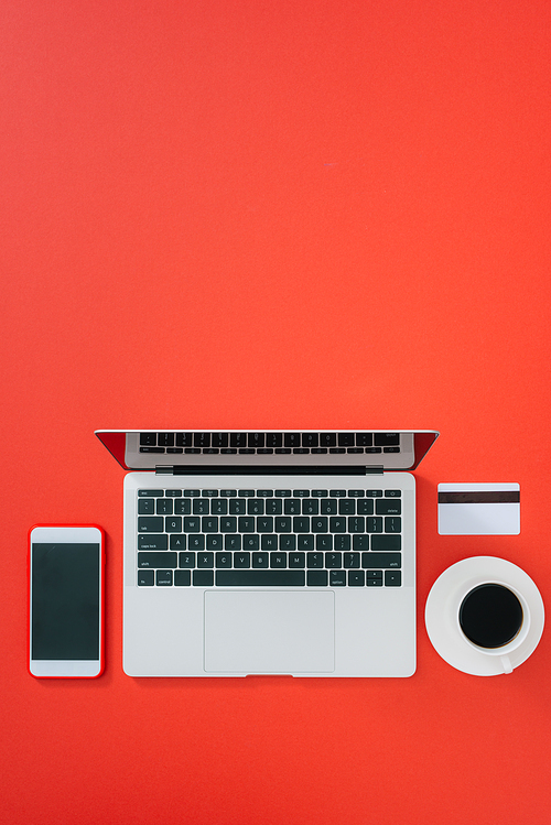 Credit card, keyboard and christmas presents on grey table flat lay, copy space.