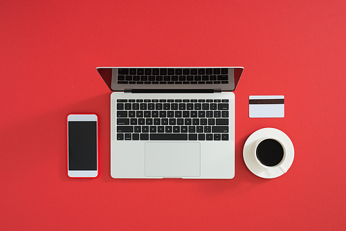 Credit card, keyboard and christmas presents on grey table flat lay, copy space.