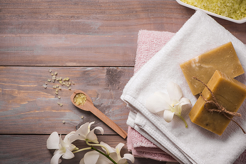 Spa set. Handmade, natural organic soap and white orchid on a wooden background