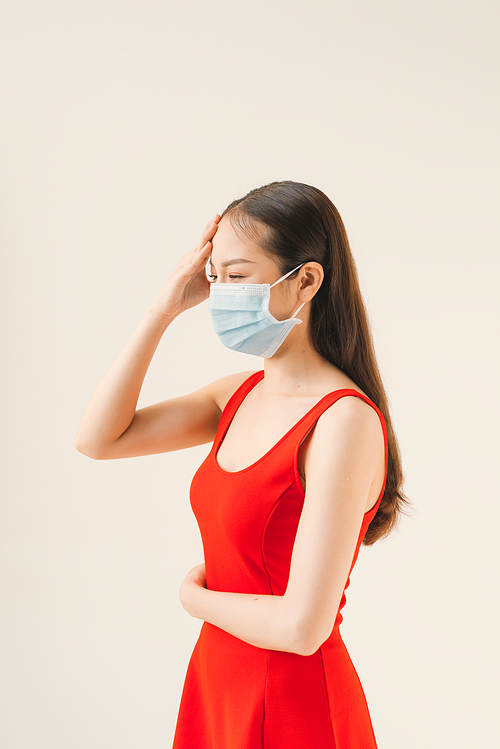 Asian women wear masks to protect disease and the headache from a virus on white background.