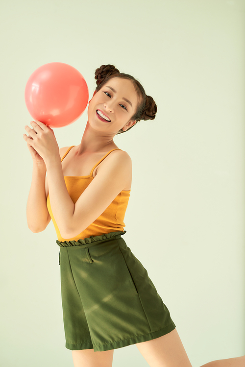 Portrait of nice cute lovable adorable attractive lovely cheerful cheery positive girl holding air baloon