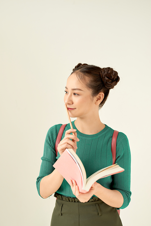 woman with pencil and book