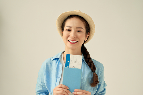 Business woman traveling holding passport, ticket and bag - isolated