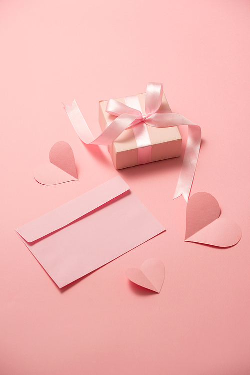 Woman's Day; romantic template; mock up with heart paper; pink box gift; bow ribbon and envelope in pink background