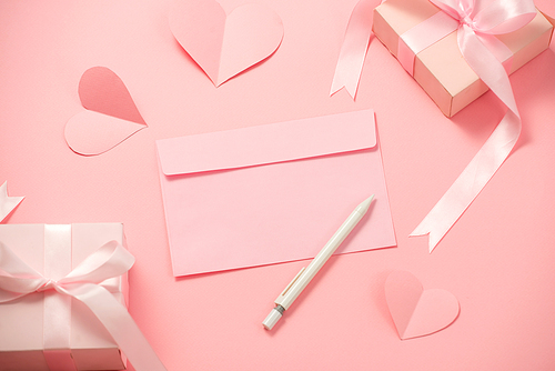 Woman's Day; romantic template; mock up with heart paper; pink box gift; bow ribbon and envelope in pink background