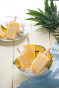 Homemade ice cream or popsicles from pineapple decorated. Top view. Frozen fruit pulp. Summer sweets