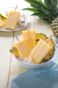 Homemade ice cream or popsicles from pineapple decorated. Top view. Frozen fruit pulp. Summer sweets