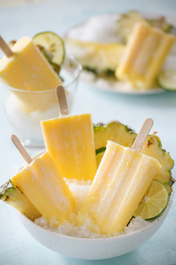 Homemade Pineapple Popsicles on a bowl(selective focus; close-up shot)