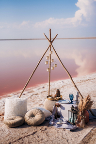 moroccan decor on the shores of a beautiful lake, candles and bungalows