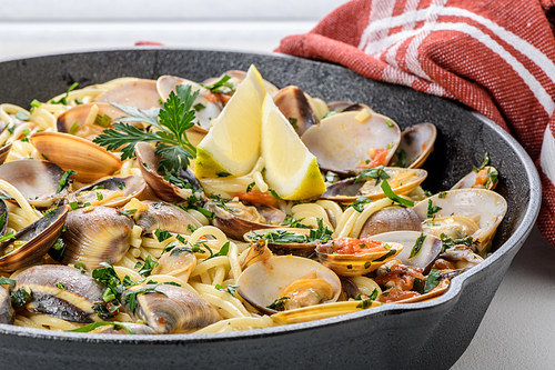 Traditional italian seafood pasta with clams Spaghetti alle Vongole.