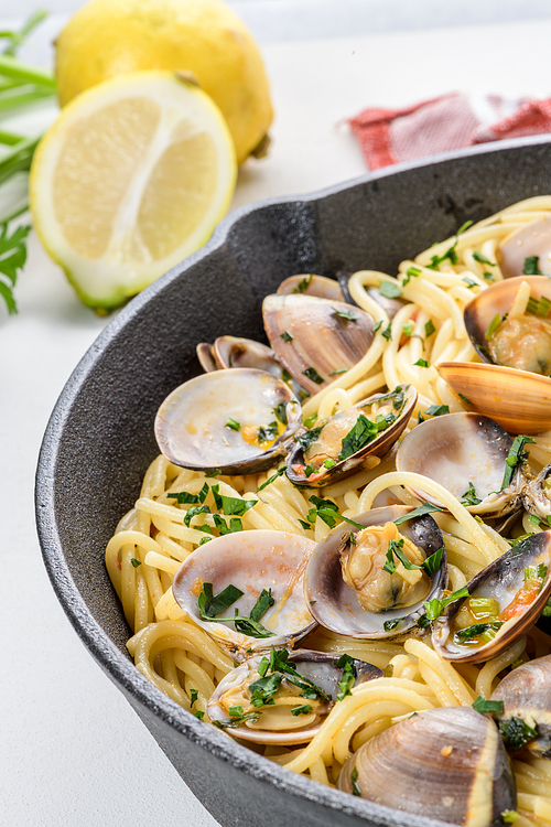 Traditional italian seafood pasta with clams Spaghetti alle Vongole.