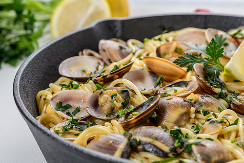 Traditional italian seafood pasta with clams Spaghetti alle Vongole.