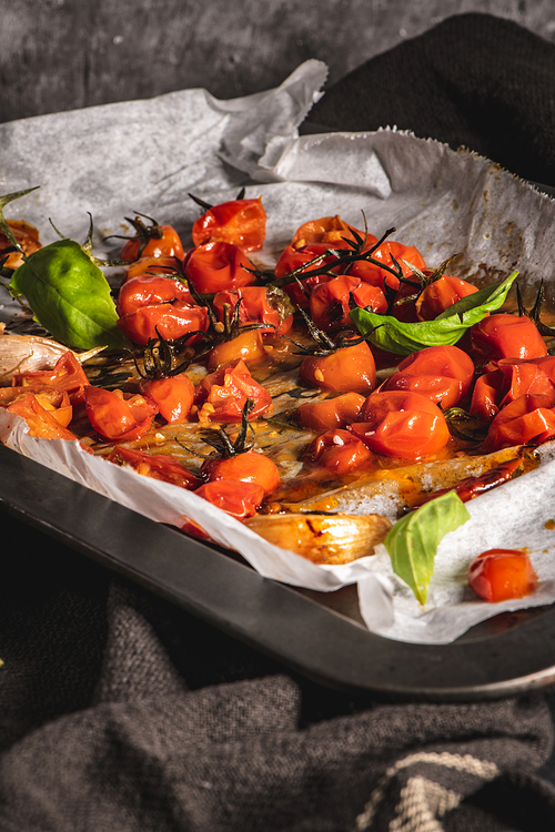 Roasted cherry tomotoes. Mediterranean food recipe idea.