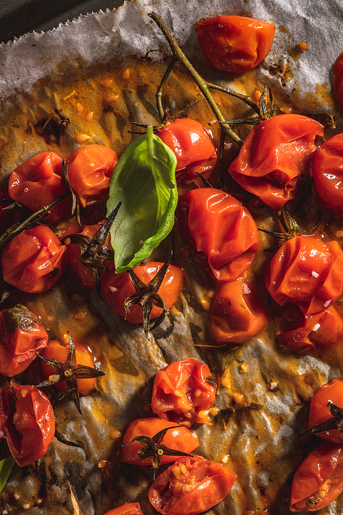 Roasted cherry tomotoes. Mediterranean food recipe idea.
