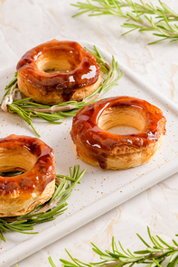 Typical Portuguese pastry Glorias, tender puff pastry topped with handmade caramel candy and special sugar syrup.