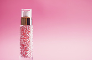 Skincare product on pink background, beauty and cosmetics.