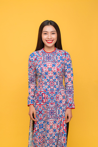 Vietnamese woman traditional festival costume Ao Dai. Tet holiday. Lunar New Year.