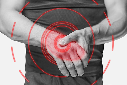 Carpal syndrome in a male wrist. Monochrome image, isolated on a white background. Pain area of red color.