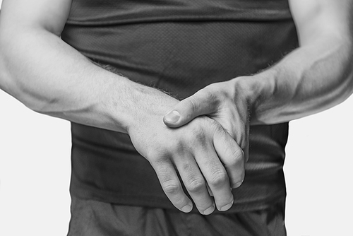 Carpal syndrome in a male wrist. Monochrome image, isolated on a white background.