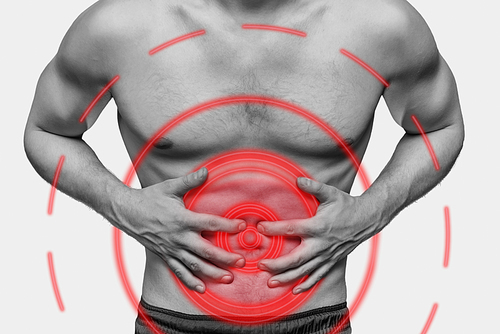 Unrecognizable man compresses his abdomen due to acute pain. Monochrome image, isolated on a white background. Pain area of red color.