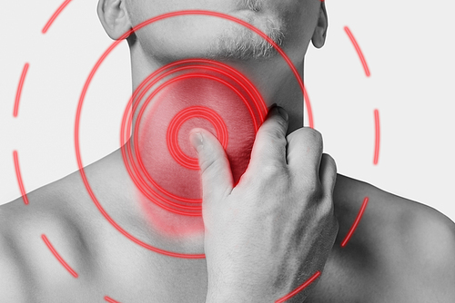 Man holding his sore throat, acute pain. Monochrome image, isolated on a white background. Pain area of red color.