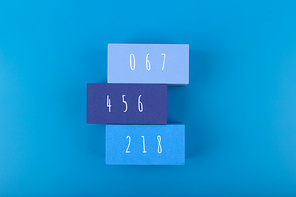 Squid Game Korean movie concept. Squid Game Korean movie concept. People numbers on rectangles on blue background. Minimal background with Squid Game movie numbers 067, 456, 218