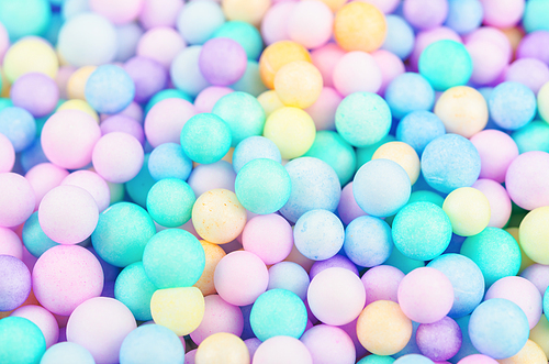 The Foam beads of various colors brightly colored abstract background.