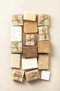 Flat lay composition with Handmade natural eco soap bars on beige background. Healthy lifestyle, beauty, skin care. Zero waste. Sustainable lifestyle concept.