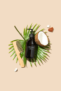 Natural cosmetics, coconut oil hair treatment concept, view from above, flat lay