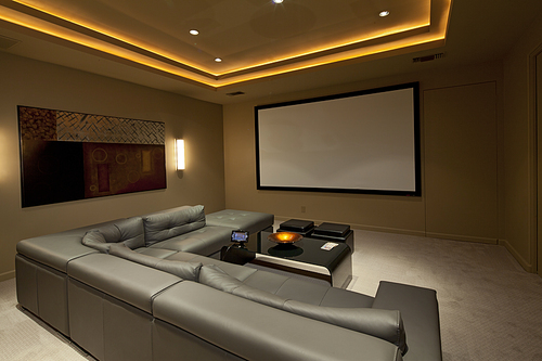 Empty media room with leather furniture in luxury villa