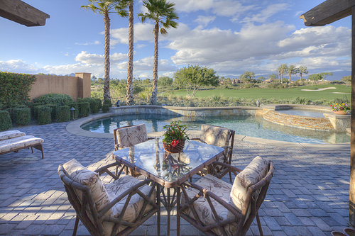 Outdoors table and chair in patio of mansion