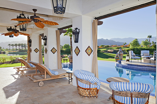 Seating furniture in patio of modern mansion