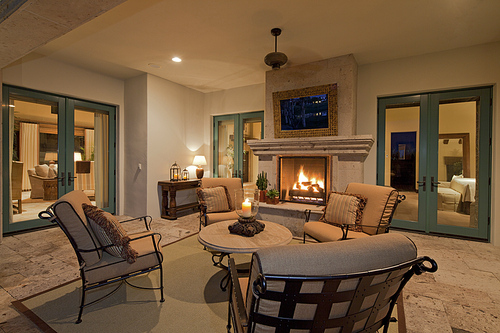 Seating furniture near fireplace in living room of villa