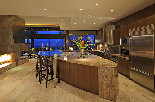 Contemporary kitchen of manor house under lights