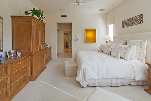 Wooden cabinets and closet in luxury bedroom of villa