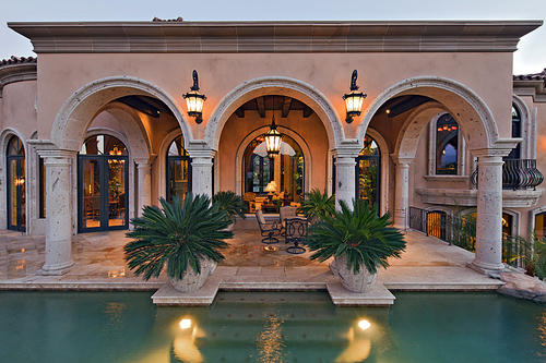 View of patio of with swimming pool in manor house